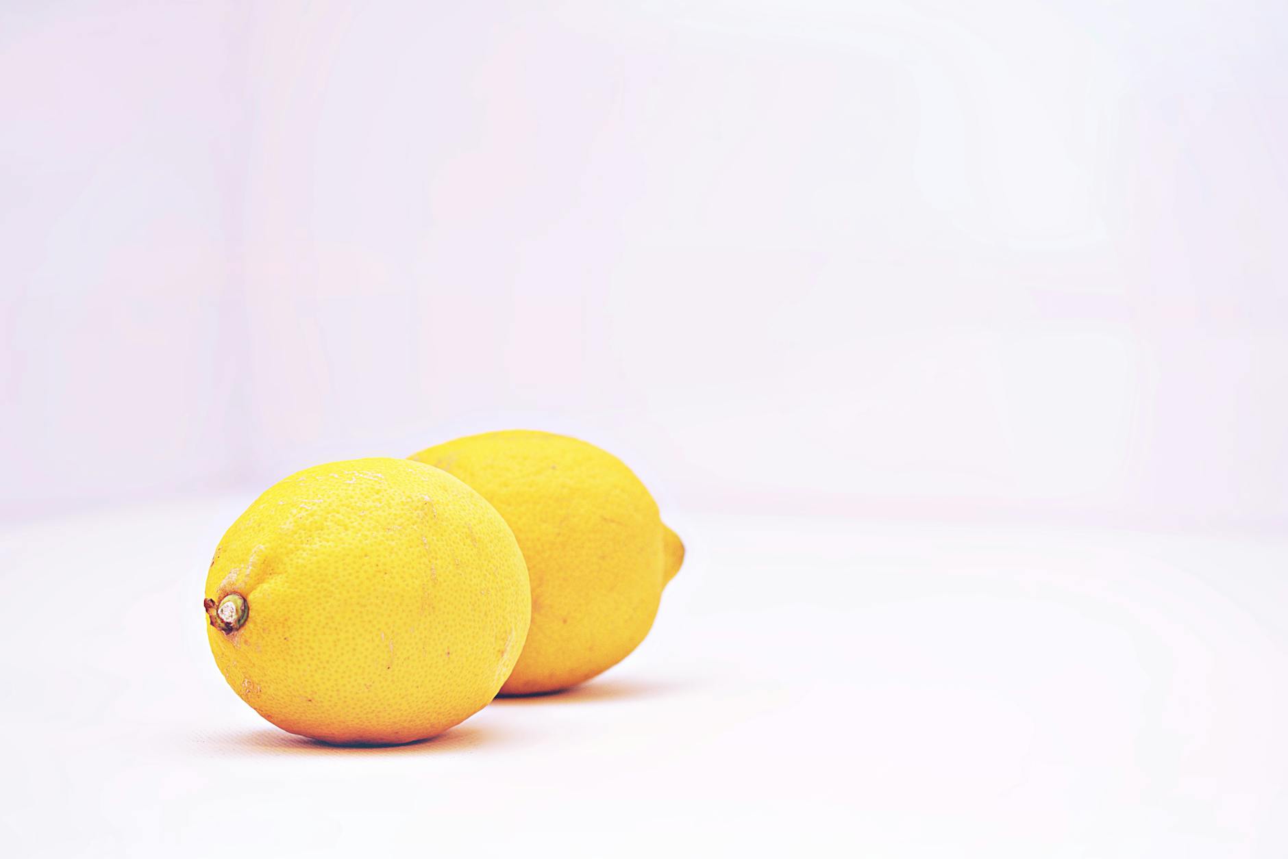 Blue silicone lemon vibrator held in hand, symbolizing partnered intimacy and pleasure